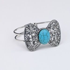Turquoise silver tone "bow" cuff bracelet